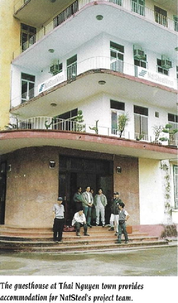 A group of people standing outside of a buildingDescription automatically generated
